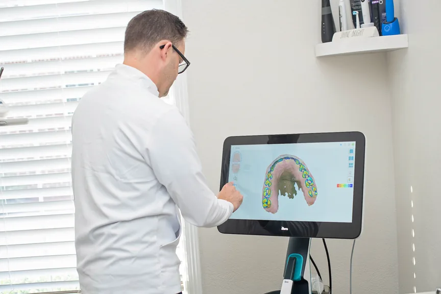 Dr. Joshua Prentice reviewing a comprehensive dental scan for general dentistry