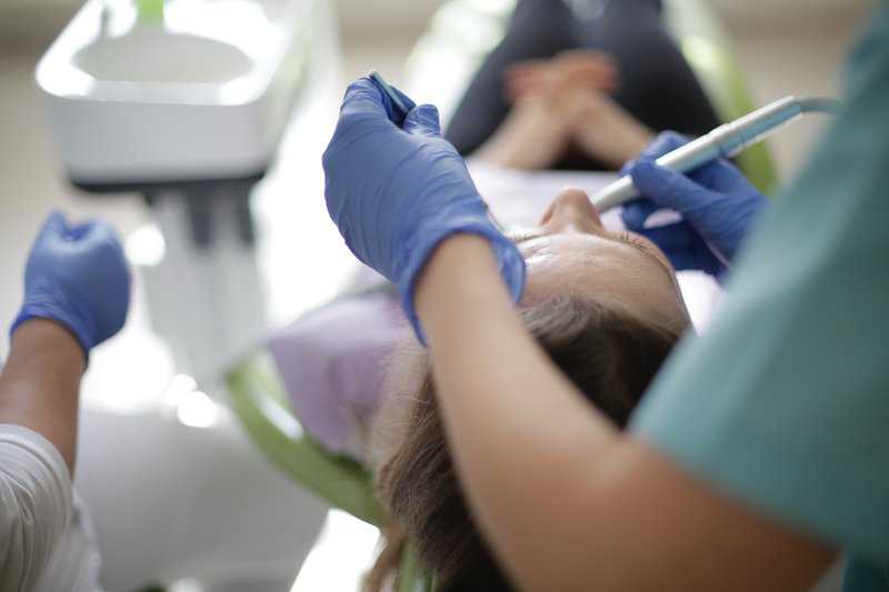 Why Do Dentists Poke at Your Gums and Say Numbers?